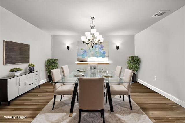 222 Oakcrest Dr, Justin, TX 76247 - dining space with wood finished floors, a chandelier, and baseboards