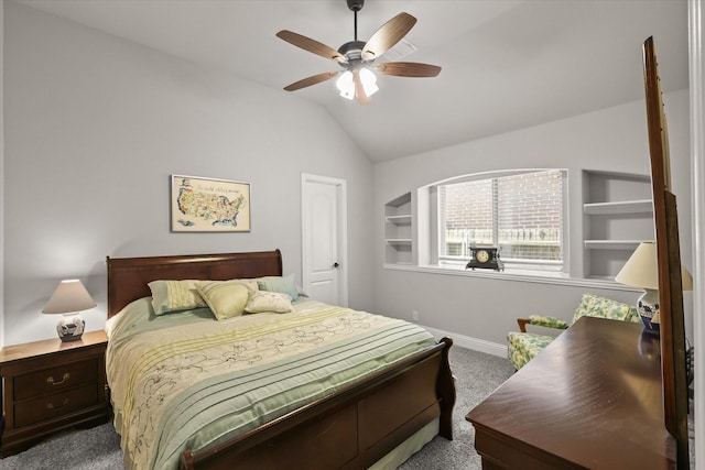 bedroom with a ceiling fan, baseboards, vaulted ceiling, and carpet flooring