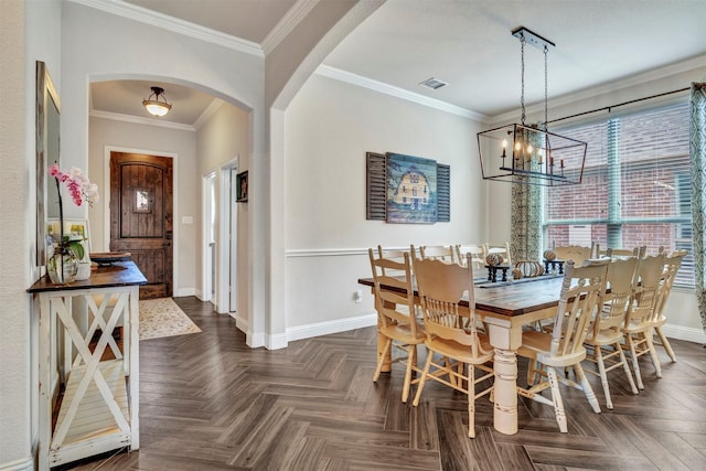 dining space with visible vents, baseboards, arched walkways, ornamental molding, and a notable chandelier