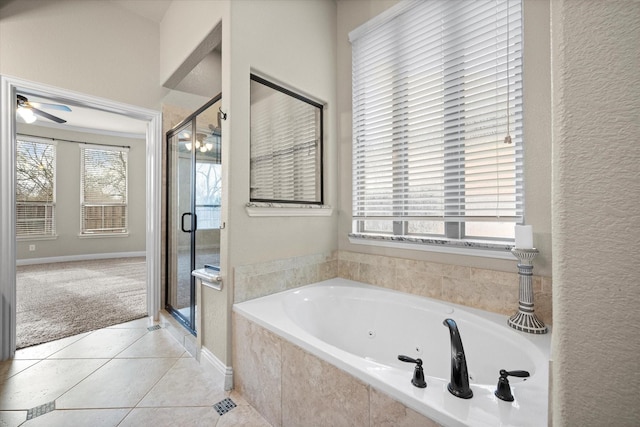 bathroom featuring tile patterned flooring, a stall shower, a whirlpool tub, and ceiling fan