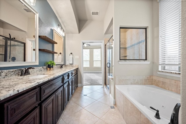 full bath featuring a tub with jets, visible vents, a stall shower, a sink, and tile patterned flooring