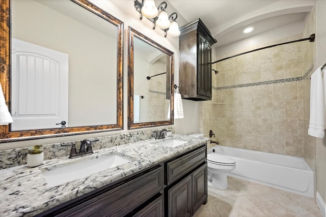 bathroom with a sink, toilet, shower / washtub combination, and tile patterned floors