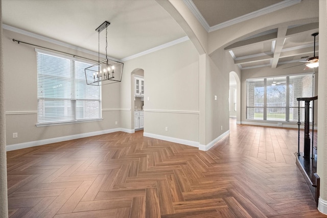 unfurnished dining area with arched walkways, a healthy amount of sunlight, and ceiling fan with notable chandelier