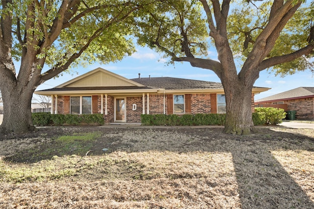 single story home with brick siding