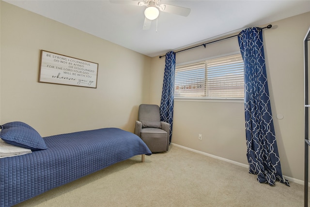 bedroom with ceiling fan, carpet flooring, and baseboards