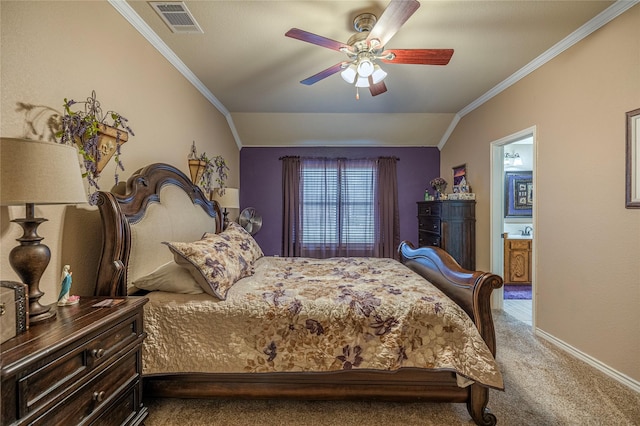 carpeted bedroom featuring visible vents, a ceiling fan, lofted ceiling, ensuite bathroom, and crown molding