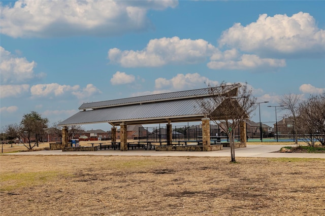 view of property's community featuring fence and a gazebo