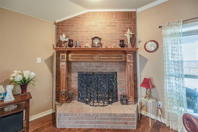 living room with lofted ceiling, a fireplace, wood finished floors, and baseboards