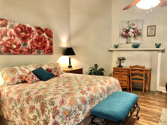 bedroom featuring ceiling fan and wood finished floors