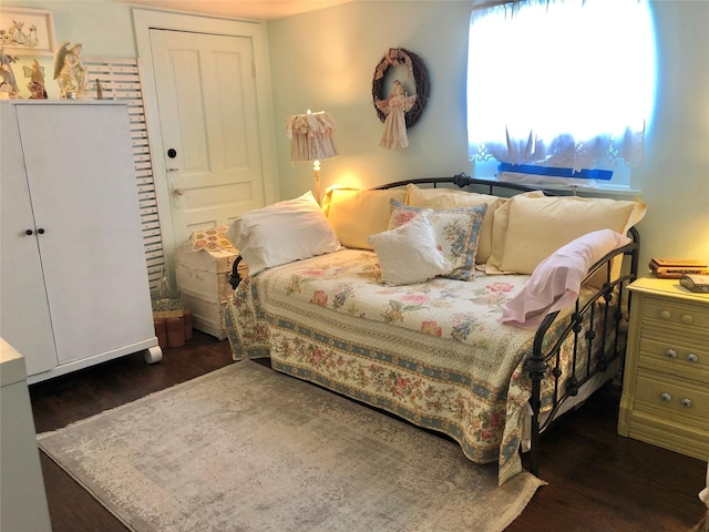 bedroom with wood finished floors