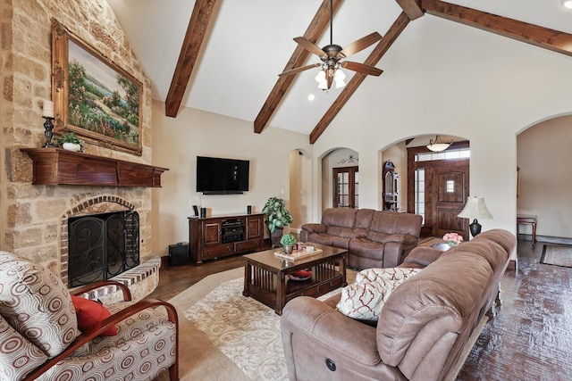 living room featuring arched walkways, high vaulted ceiling, a fireplace, and beam ceiling