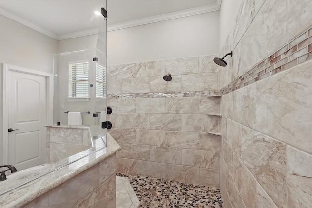 bathroom featuring ornamental molding and walk in shower