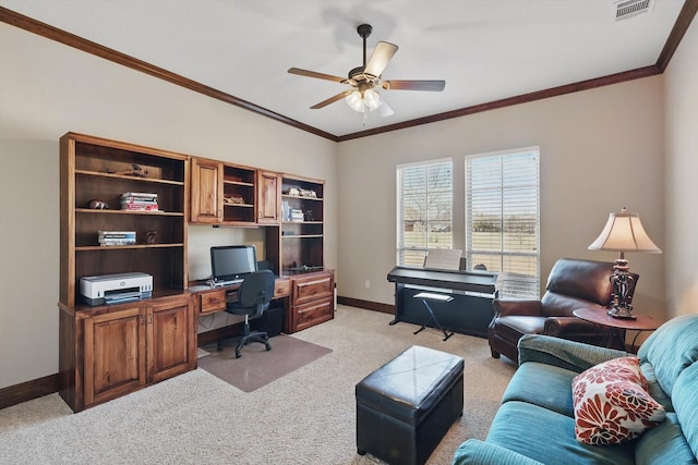 office space featuring crown molding, light colored carpet, visible vents, ceiling fan, and baseboards