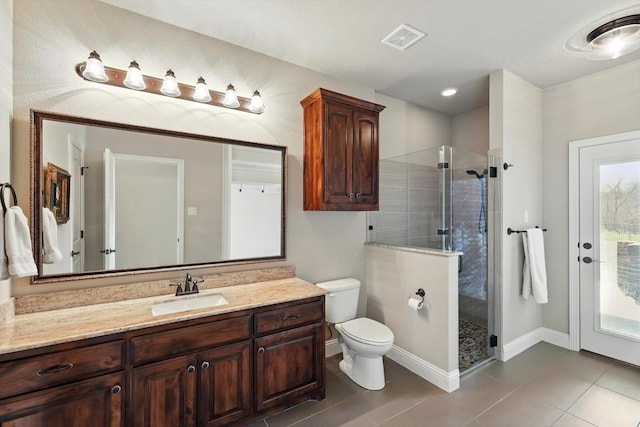 full bathroom featuring tile patterned flooring, toilet, visible vents, vanity, and a shower stall