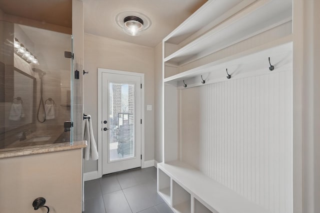 mudroom featuring baseboards and tile patterned floors