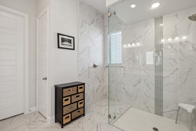 bathroom featuring marble finish floor, a marble finish shower, and recessed lighting