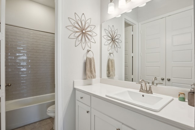 bathroom with toilet, tile patterned floors, shower / bathing tub combination, and vanity