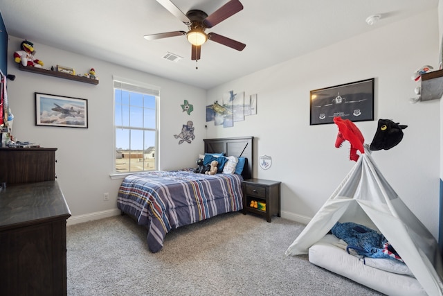 bedroom with a ceiling fan, carpet flooring, visible vents, and baseboards