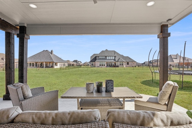 view of patio featuring a fenced backyard, a trampoline, and outdoor lounge area