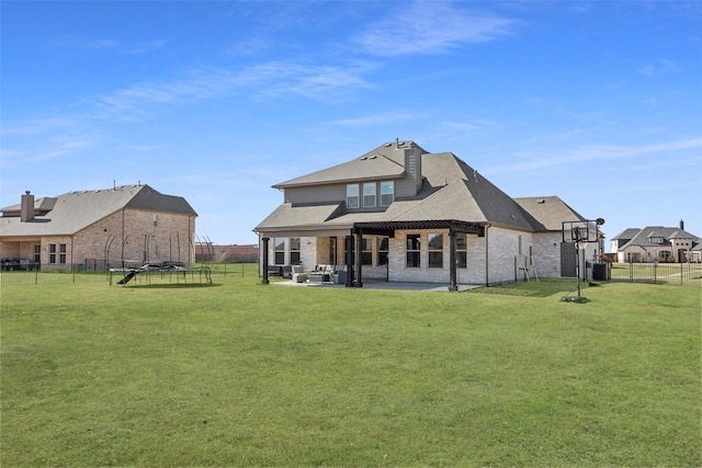 back of house featuring a yard, a patio area, and a fenced backyard