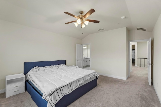 bedroom featuring vaulted ceiling, baseboards, visible vents, and light colored carpet