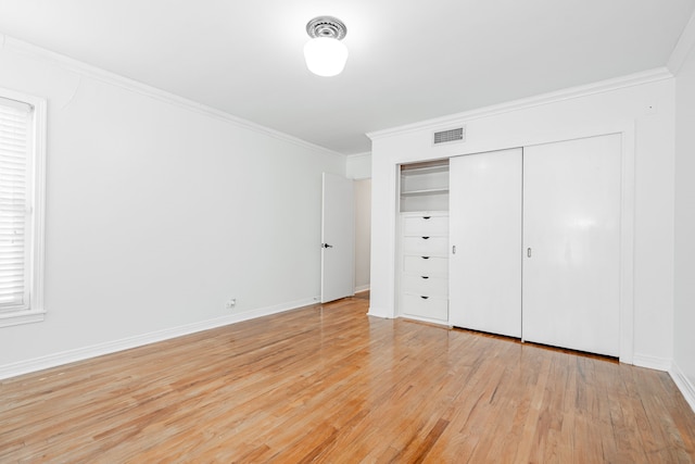 1265 S Main St, Jacksboro, TX 76458 - unfurnished bedroom with crown molding, light wood finished floors, baseboards, and a closet