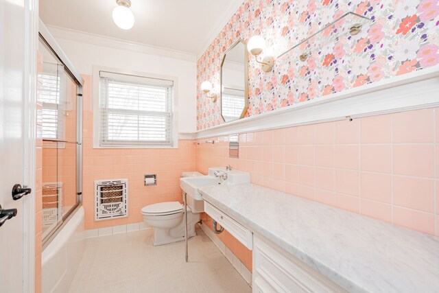 1265 S Main St, Jacksboro, TX 76458 - bathroom with heating unit, wallpapered walls, ornamental molding, vanity, and a wainscoted wall