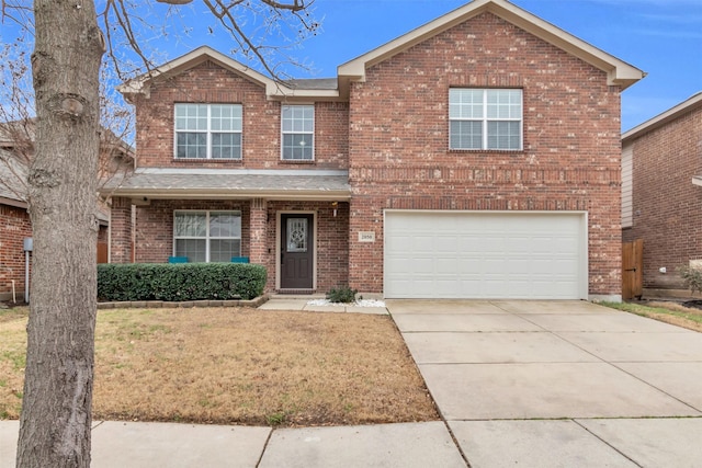 traditional home with a garage, driveway, brick siding, and a front yard