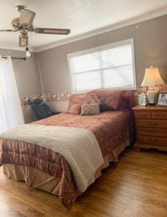 429 Broadway St, Bells, TX 75414 - bedroom featuring ornamental molding, wood finished floors, and a ceiling fan