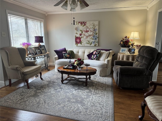 living area featuring ceiling fan, crown molding, a textured ceiling, and wood finished floors