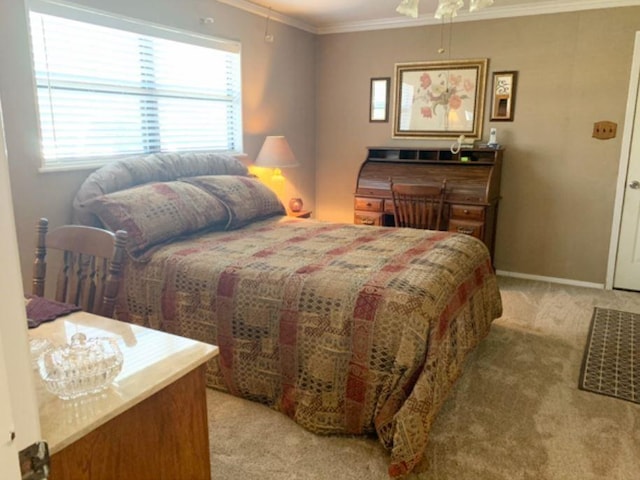 bedroom with ornamental molding, light colored carpet, baseboards, and a ceiling fan