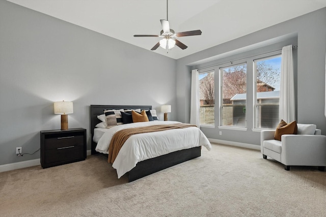 bedroom featuring a ceiling fan, carpet, and baseboards