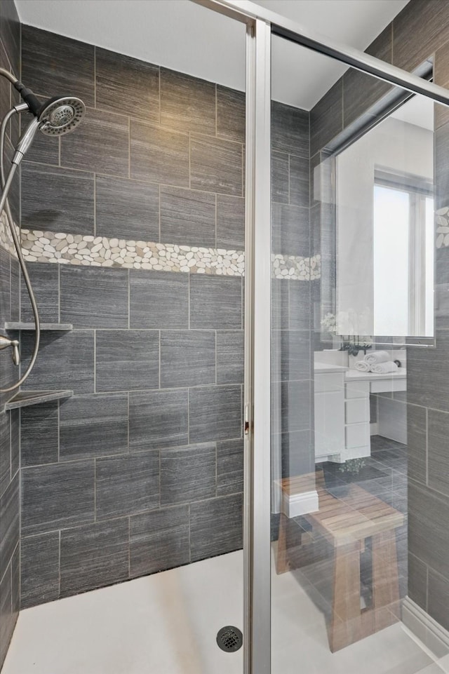 bathroom with a shower stall