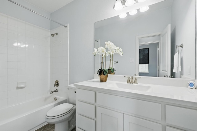 bathroom featuring vanity, toilet, and shower / bathtub combination