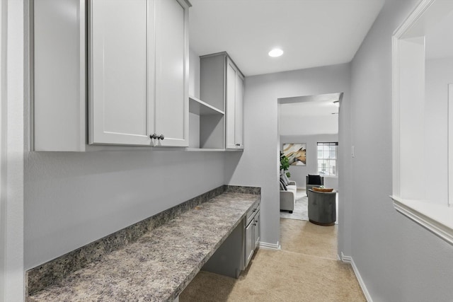 bar with recessed lighting, light colored carpet, and baseboards