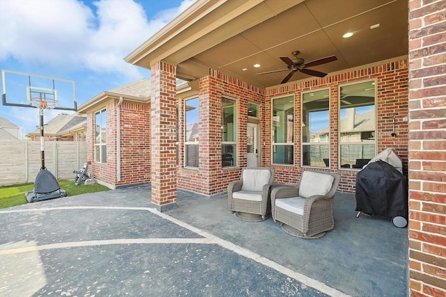 view of patio / terrace featuring grilling area, a ceiling fan, and fence