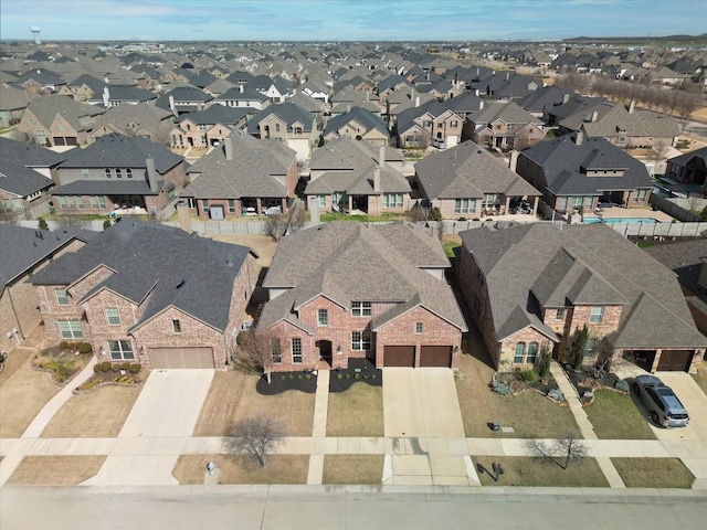 birds eye view of property with a residential view