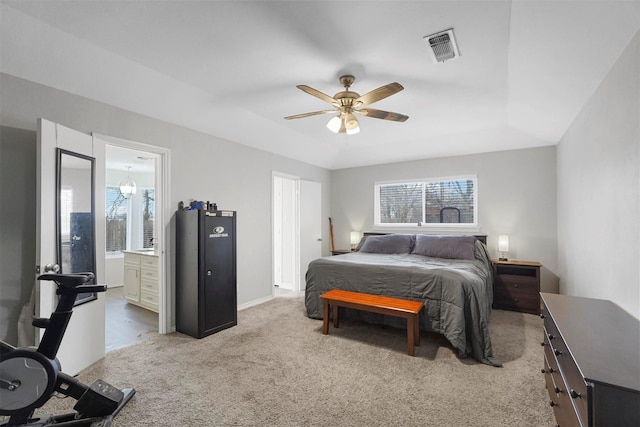 bedroom featuring visible vents, multiple windows, carpet, and a raised ceiling