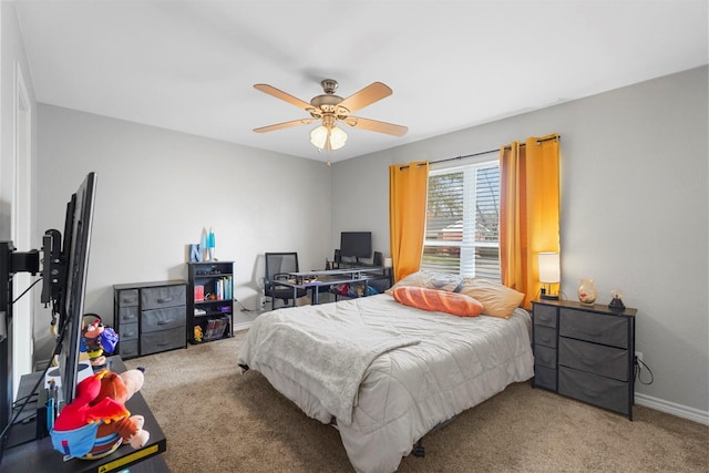 bedroom with a ceiling fan, baseboards, and carpet floors