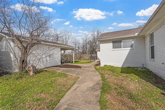 view of yard featuring a patio and fence