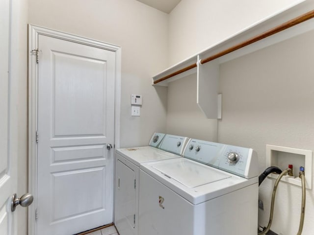 clothes washing area with laundry area and separate washer and dryer