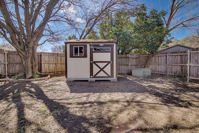 view of shed with a fenced backyard