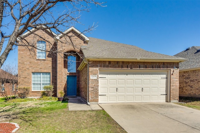 view of front of property with brick siding, driveway, and a shingled roof