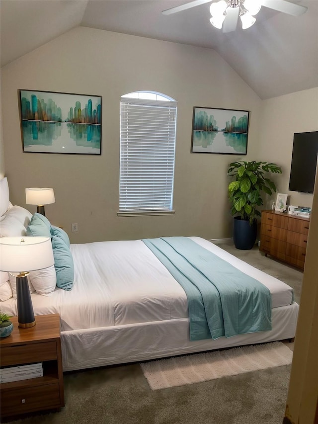 bedroom featuring vaulted ceiling, ceiling fan, and carpet floors