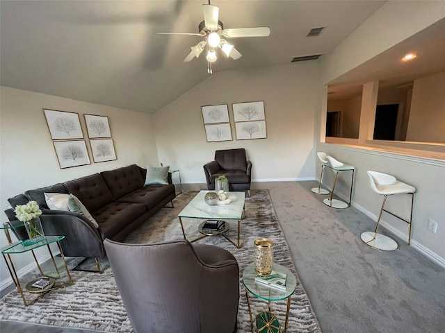 living room featuring visible vents, baseboards, vaulted ceiling, carpet floors, and a ceiling fan