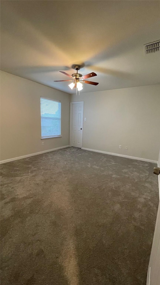 12417 Sunrise Dr, Frisco, TX 75036 - spare room with dark colored carpet, baseboards, and a ceiling fan