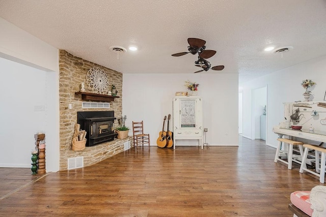 interior space featuring wood finished floors, visible vents, and a textured ceiling