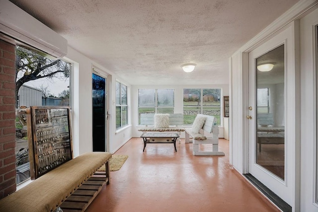 sunroom / solarium with a wall unit AC