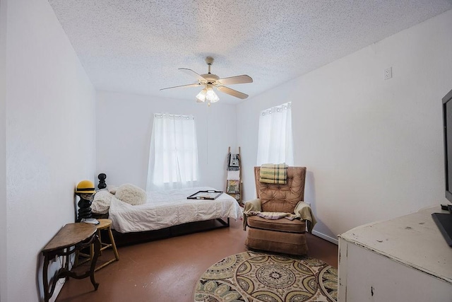 bedroom featuring a textured ceiling and a ceiling fan