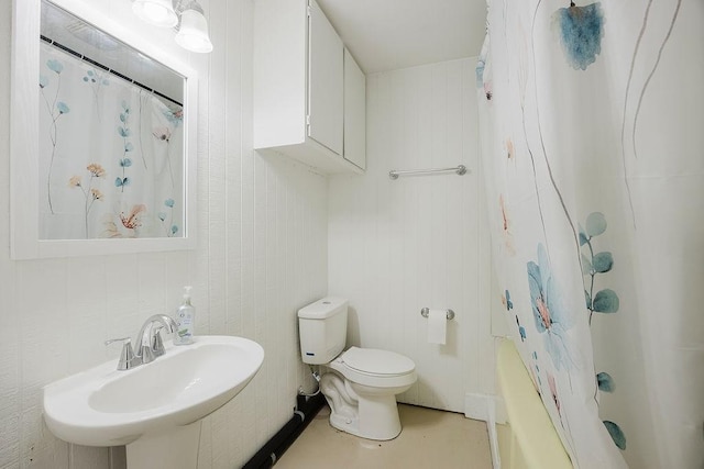 full bathroom with toilet and a sink